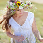 Beautiful woman with flower wreath