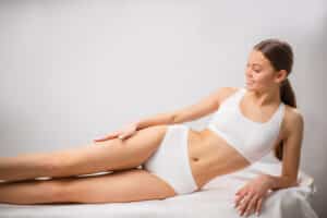 A woman lying on her side after laser hair removal in Lewisville, TX